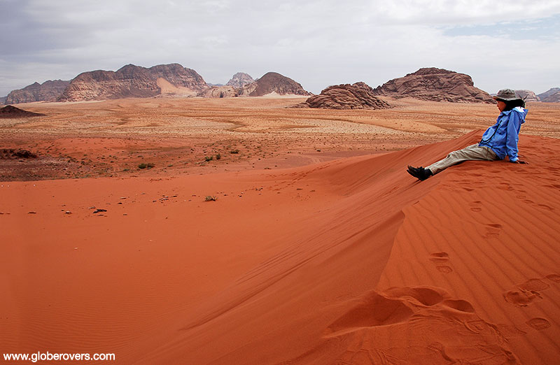 Pondering over the desert of Wadi Rum south of Petra, Jordan