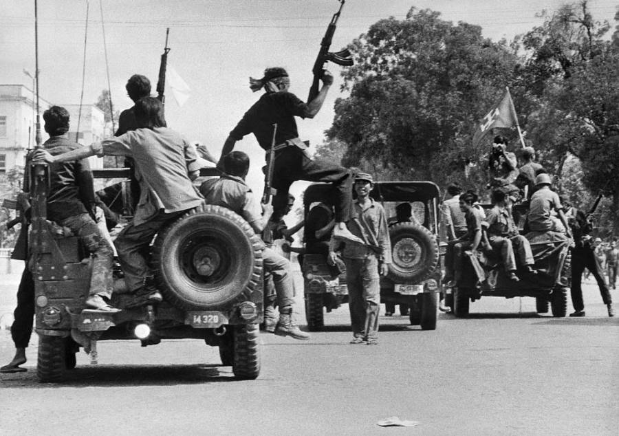 Khmer Rouge soldiers drive through the capital. Phnom Penh. 1975. SJOBERG/AFP/Getty Images