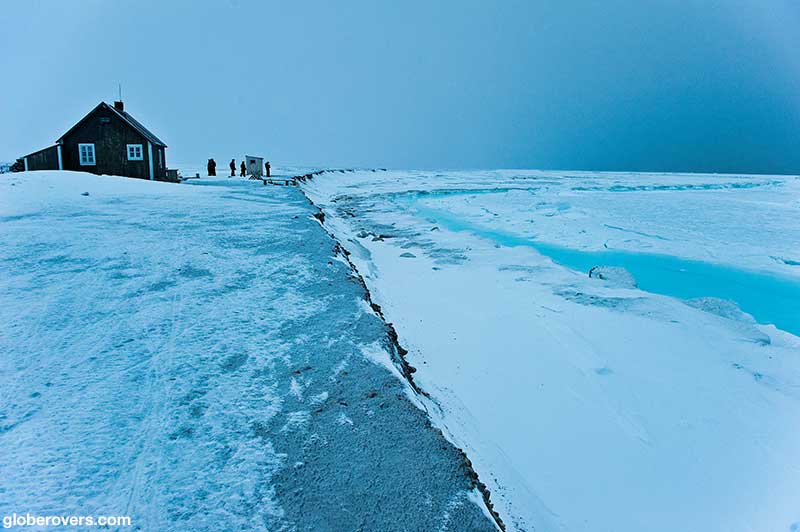 Little house by the frozen fjord, Svalbard Islands, Norway