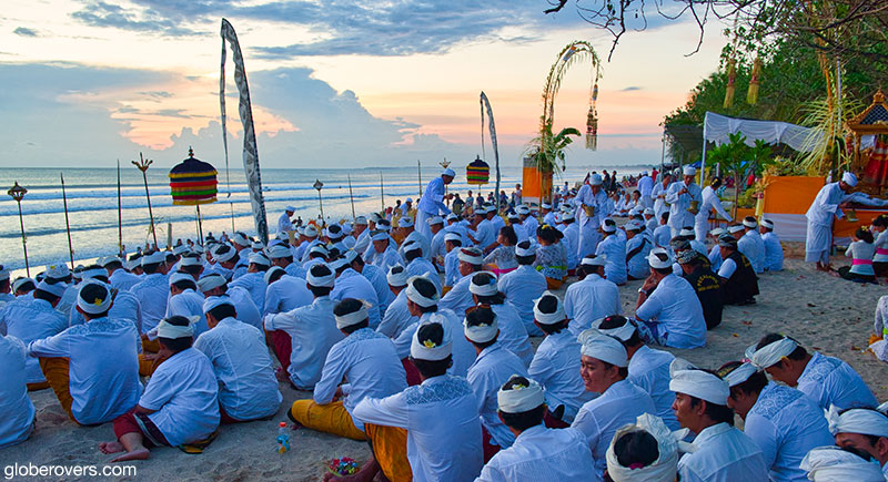 Hindu rituals at sunset on Kuta beach, Bali, Indonesia