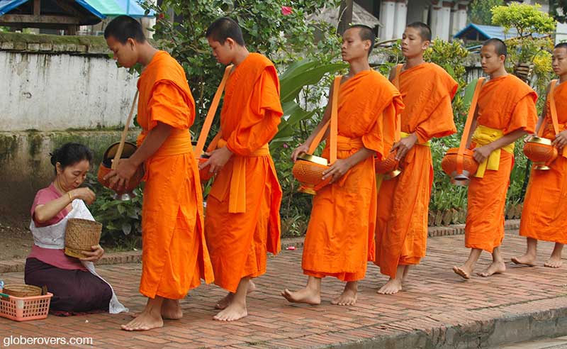 Monks receiving alms early in the morning, Luang Prabang , Laos