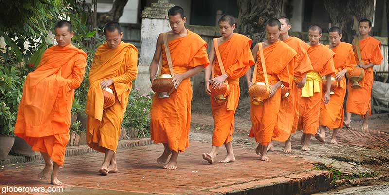 Monks receiving alms early in the morning, Luang Prabang, Laos
