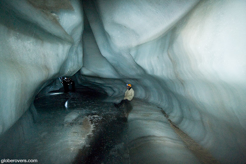 Walking on a frozen river inside (or underneath) the glacier, Svalbard Islands, Norway.