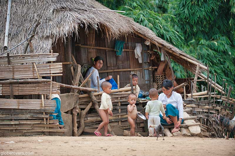 People in hut at Pang Pack, a Lahu-shi village, west of Keng Tung, Shan State, Myanmar