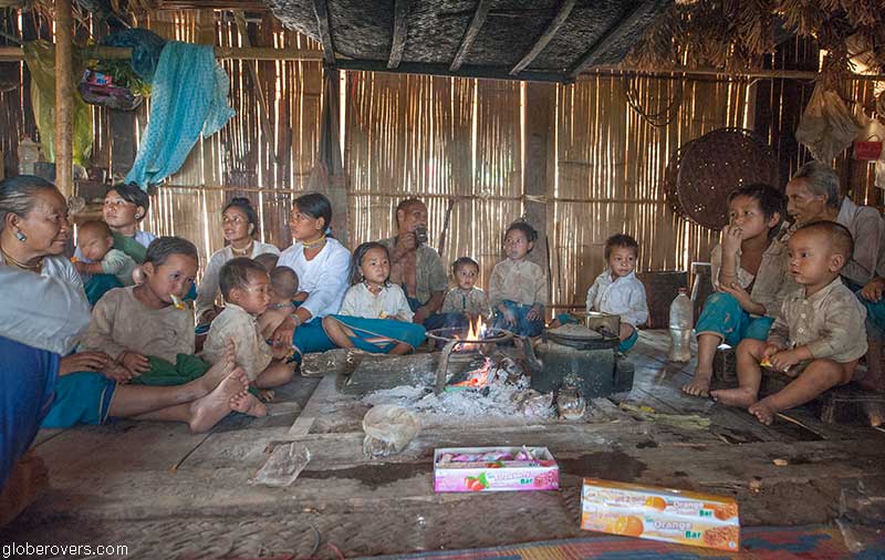 People in hut at Pang Pak Lahu-shi village, west of Kengtung, Shan State, Myanmar
