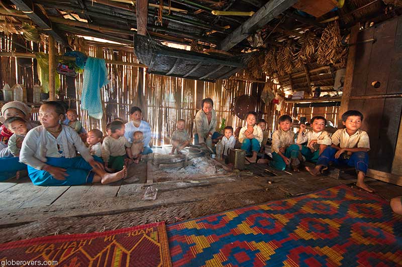 People in hut at Pang Pack, a Lahu-shi village, west of Keng Tung, Shan State, Myanmar