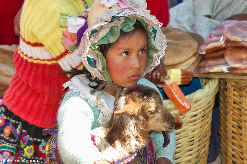 Girl Pisac village market in Sacred Valley, Peru
