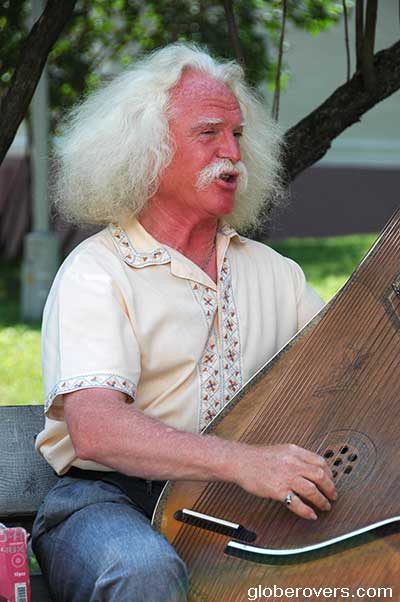 Torban payed by musician on the grounds of St. Sophia's Cathedral, Kiev, Ukraine