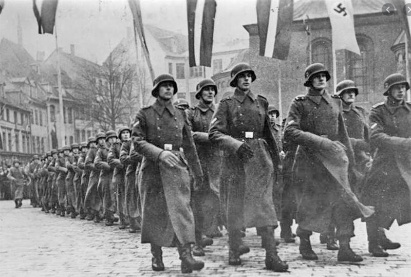 Latvian Legion (Waffen-SS) marching next to Dome Cathedral in Riga on Latvian Independence Day, 1943