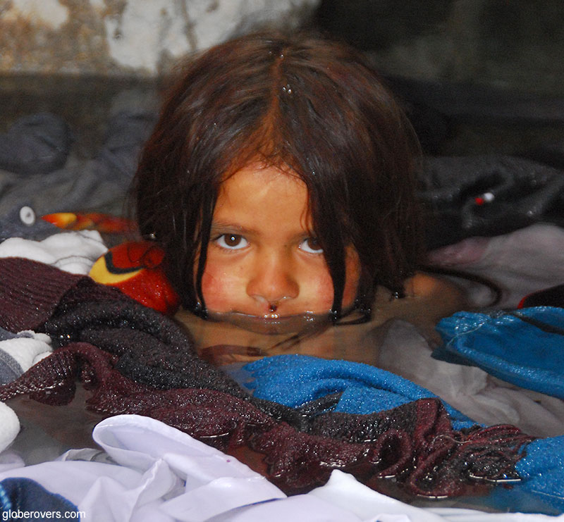 Girl in hot springs at Yashil-Kul Lake (Green Lake) near Bulunkul Village, Driving from Ishkashim to Murgab along the Wakhan Valley, Tajikistan