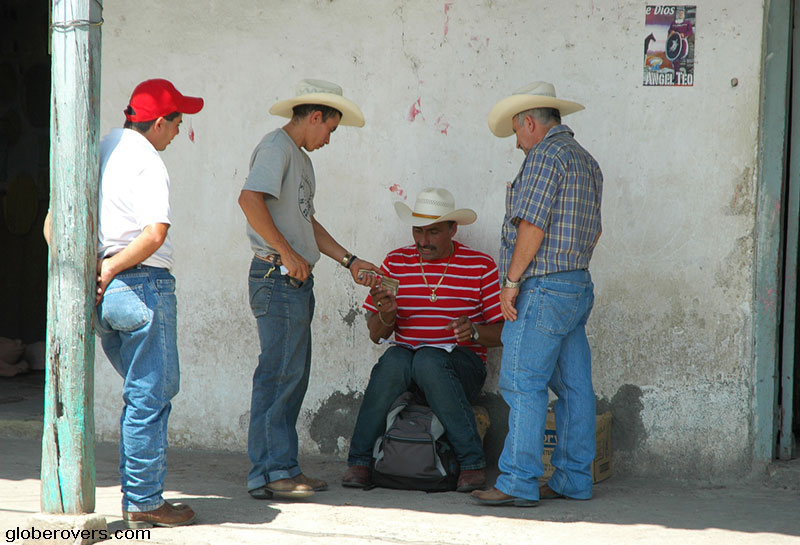 Cowboys making a money deal in Copan Ruinas, Honduras
